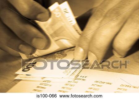 Stock Photograph - Counting money. Fotosearch