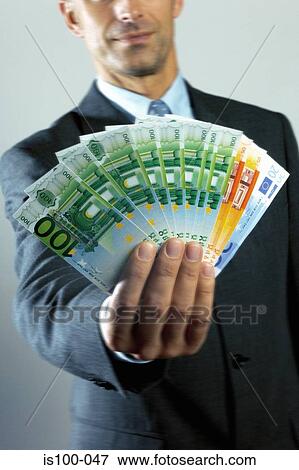 Man holding banknotes View Large Photo Image Stock Photo - Man holding banknotes. Fotosearch