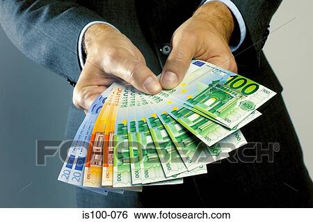 Man holding banknotes View Large Photo Image Stock Photograph - Man holding banknotes. Fotosearch