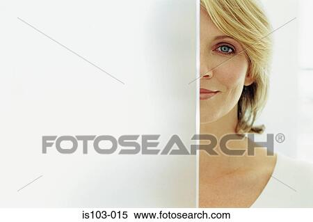 Stock Photography - Portrait of a half concealed businesswoman. Fotosearch