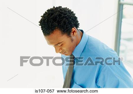 Stock Photo - Businessman looking downcast. Fotosearch