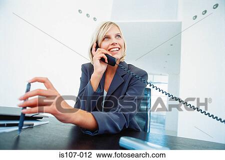 Businesswoman on telephone View Large Photo Image Stock Image - Businesswoman on telephone. Fotosearch