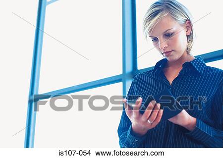 Businesswoman with personal organiser View Large Photo Image Picture - Businesswoman with personal organiser. Fotosearch