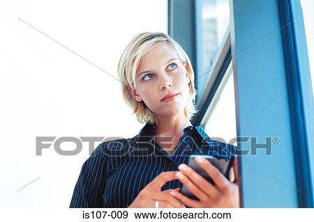 Businesswoman with personal organiser View Large Photo Image Stock Photo - Businesswoman with personal organiser. Fotosearch