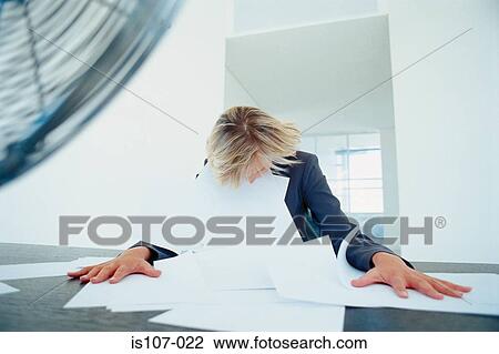 Stock Image - Chaotic businesswoman. Fotosearch