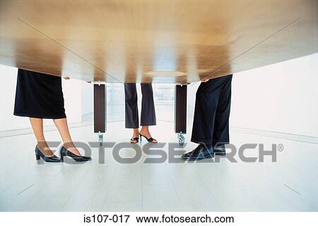Legs and feet of businesspeople View Large Photo Image Stock Photo - Legs and feet of businesspeople. Fotosearch