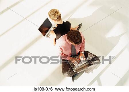 Businessman and businesswoman working together View Large Photo Image Stock Photograph - Businessman and businesswoman working together. Fotosearch