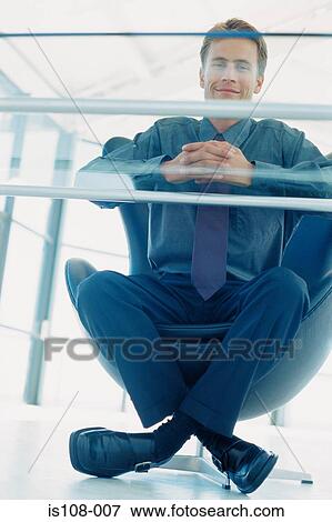 Businessman in office chair View Large Photo Image Stock Photo - Businessman in office chair. Fotosearch