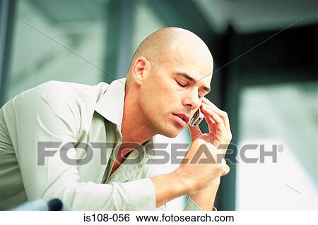 Businessman on cellphone View Large Photo Image Stock Photograph - Businessman on cellphone. Fotosearch