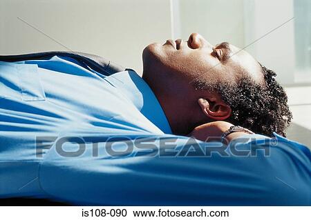 Stock Image - Businessman relaxing. Fotosearch