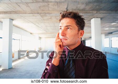 Stock Image - Businessman thinking. Fotosearch