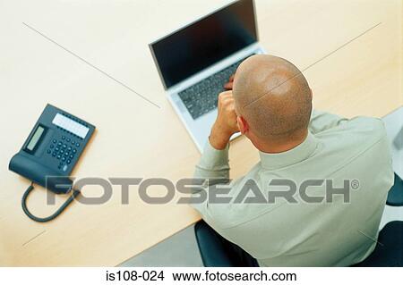Businessman working on laptop computer View Large Photo Image Picture - Businessman working on laptop computer. Fotosearch