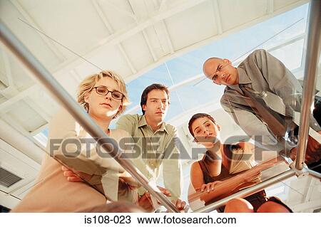 Businesspeople in office View Large Photo Image Stock Image - Businesspeople in office. Fotosearch