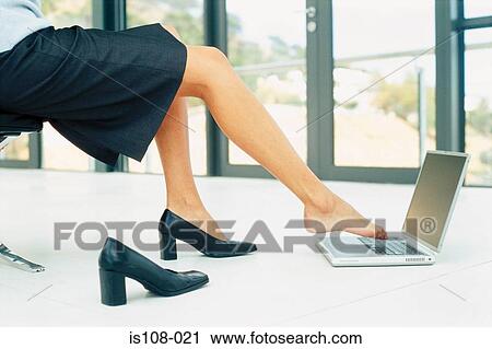 Businesswoman typing with toes View Large Photo Image Stock Image - Businesswoman typing with toes. Fotosearch
