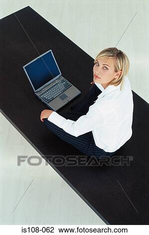 Businesswoman working on table View Large Photo Image Stock Image - Businesswoman working on table. Fotosearch