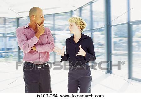 Businessman and businesswoman in empty office View Large Photo Image Picture - Businessman and businesswoman in empty office. Fotosearch