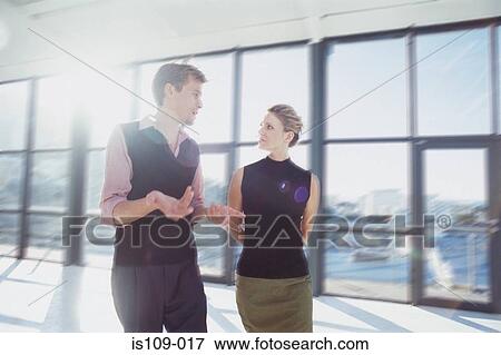 Businessman and businesswoman in empty office View Large Photo Image Stock Photo - Businessman and businesswoman in empty office. Fotosearch
