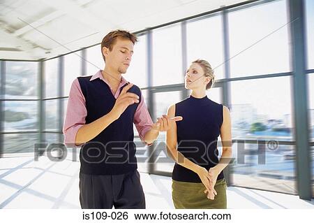Businessman and businesswoman in empty office View Large Photo Image Stock Photograph - Businessman and businesswoman in empty office. Fotosearch