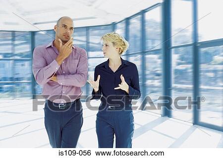 Businessman and businesswoman in empty office View Large Photo Image Stock Photograph - Businessman and businesswoman in empty office. Fotosearch