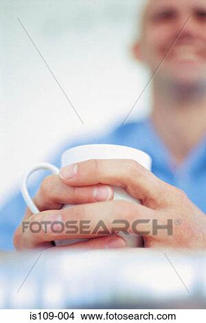 Businessman having a cup of tea View Large Photo Image Picture - Businessman having a cup of tea. Fotosearch