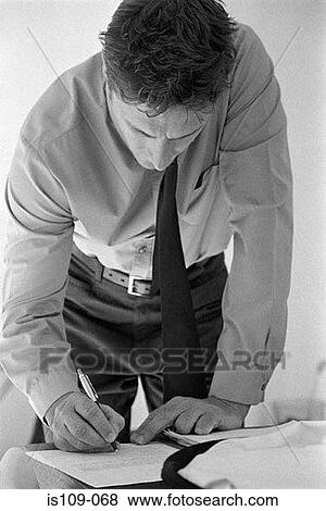Businessman signing paperwork View Large Photo Image Stock Photo - Businessman signing paperwork. Fotosearch