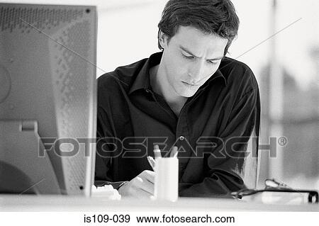 Businessman working in office View Large Photo Image Stock Photo - Businessman working in office. Fotosearch
