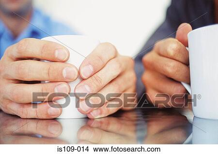 Businessmen having a cup of tea View Large Photo Image Picture - Businessmen having a cup of tea. Fotosearch