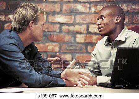 Businessmen in discussion View Large Photo Image Stock Photo - Businessmen in discussion. Fotosearch
