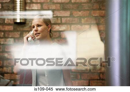 Stock Photography - Businesswoman on telephone. Fotosearch