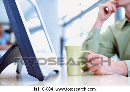 Computer and mug View Large Photo Image Picture - Computer and mug. Fotosearch