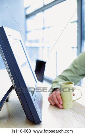 Stock Image - Computer and mug. Fotosearch