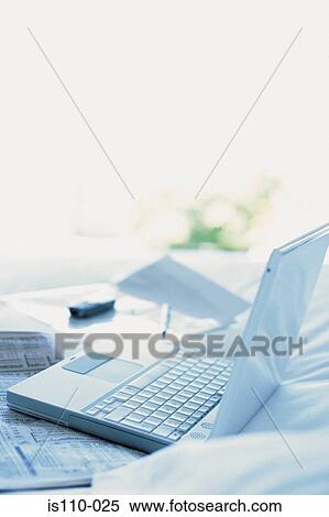 Laptop computer and cellphone on bed View Large Photo Image Stock Photography - Laptop computer and cellphone on bed. Fotosearch