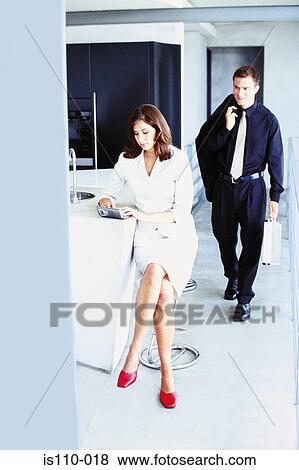 Stock Photo - Man and woman in office. Fotosearch