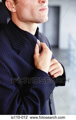 Man tying tie View Large Photo Image Stock Image - Man tying tie. Fotosearch