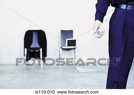 Stock Image - Man with cellphone. Fotosearch
