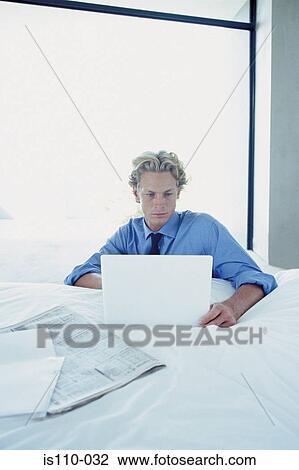 Man working on bed View Large Photo Image Stock Image - Man working on bed. Fotosearch
