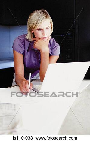 Woman working from home View Large Photo Image Stock Image - Woman working from home. Fotosearch