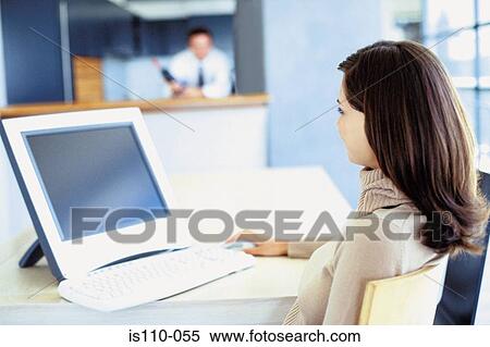 Stock Photography - Woman working from home. Fotosearch
