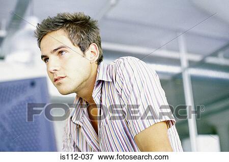 Man in an office View Large Photo Image Stock Photo - Man in an office. Fotosearch
