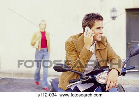Man talking on cellphone View Large Photo Image Picture - Man talking on cellphone. Fotosearch
