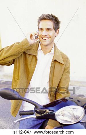 Stock Photo - Man talking on cellphone. Fotosearch
