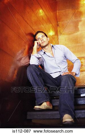 Man talking on cellphone View Large Photo Image Stock Photo - Man talking on cellphone. Fotosearch