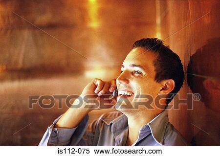 Man talking on cellphone View Large Photo Image Stock Photography - Man talking on cellphone. Fotosearch