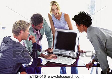 Men and woman using laptop computer View Large Photo Image Stock Photograph - Men and woman using laptop computer. Fotosearch