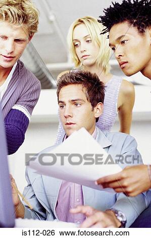 Stock Photograph - Men and woman using laptop computer. Fotosearch