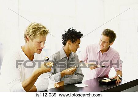 Men eating at sushi bar View Large Photo Image Stock Photo - Men eating at sushi bar. Fotosearch