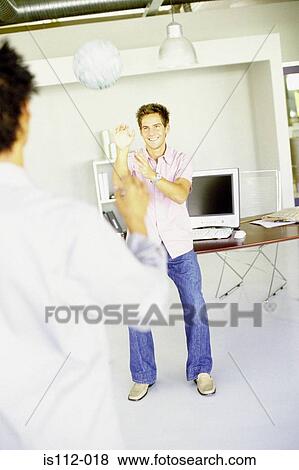 Men playing with ball in an office View Large Photo Image Stock Photo - Men playing with ball in an office. Fotosearch