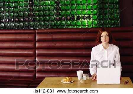 Woman having breakfast and working View Large Photo Image Stock Image - Woman having breakfast and working. Fotosearch