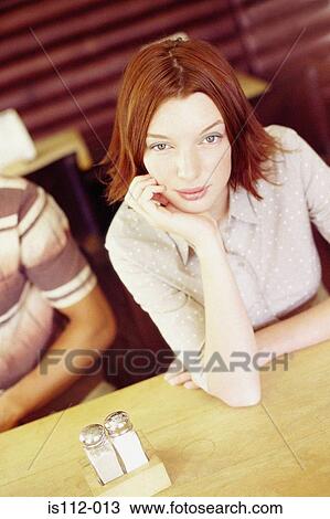 Woman sitting in cafe View Large Photo Image Stock Image - Woman sitting in cafe. Fotosearch