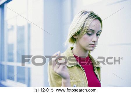 Woman smoking cigarette View Large Photo Image Stock Photography - Woman smoking cigarette. Fotosearch